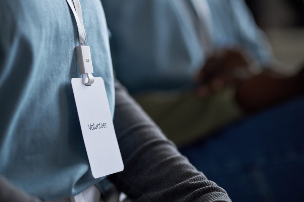 wearing volunteer badge for charity event 2025 05 19 04 19 50 utc